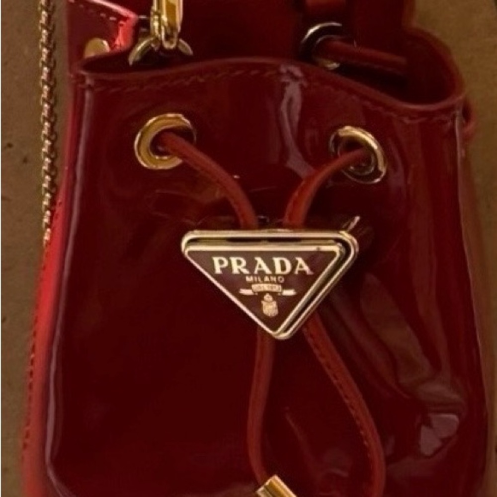 Prada Glossy Red Mini Bag with Gold Accents
BRAND NEW! $1,390 MSRP